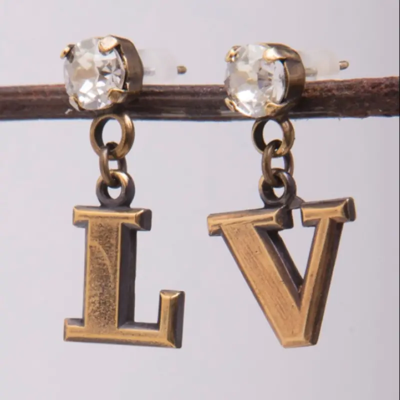 Mark Edge Lv Earrings 1